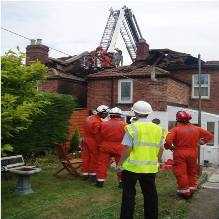 Image of surveyors inspecting dangerous structure